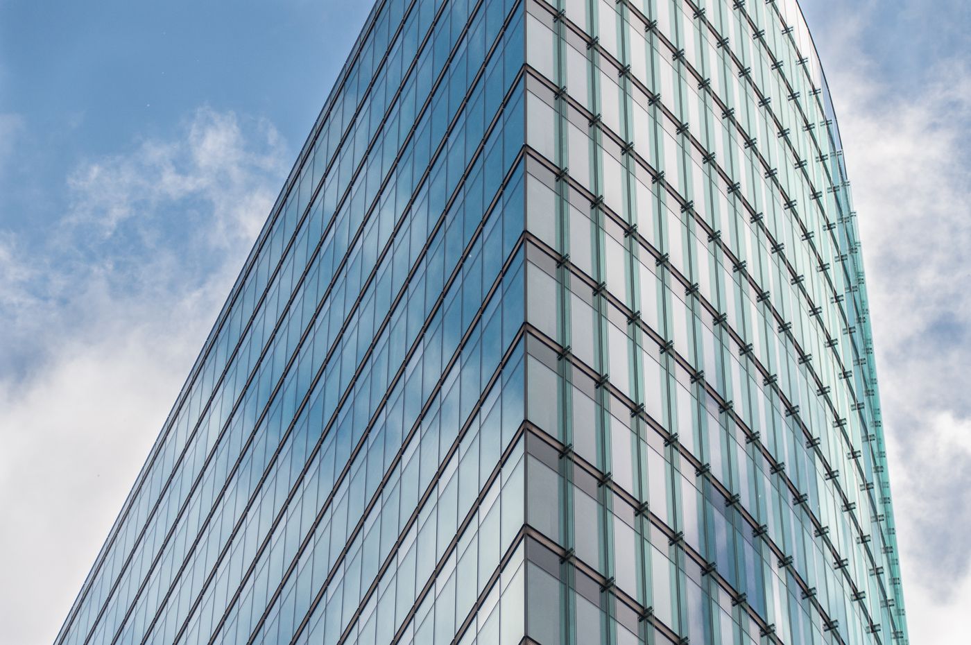 Looking up at modern glass skyscrapers